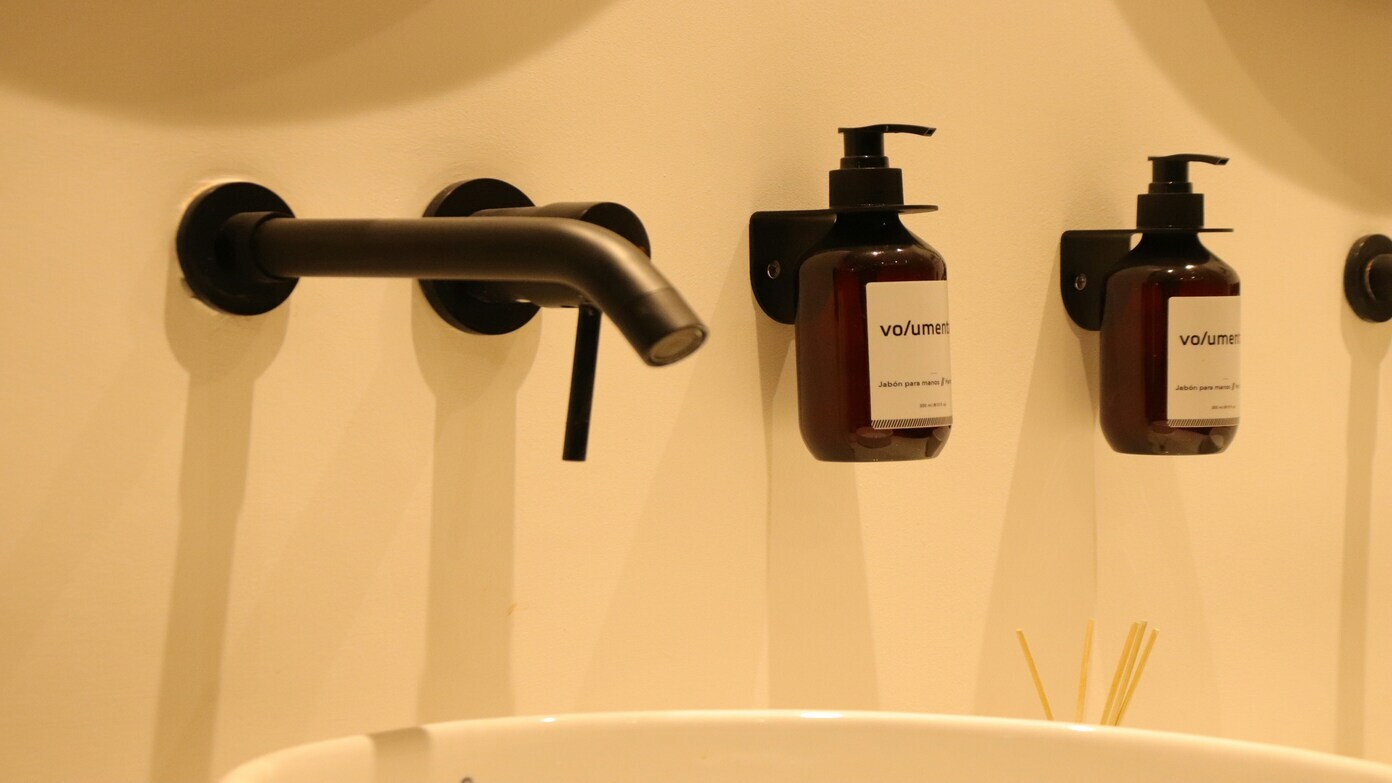 From Mini-Shampoos to Room Guides: The Hotel Room Amenities That Are Disappearing